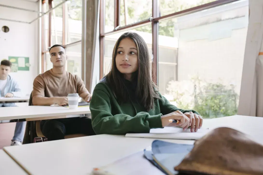 Photo of three students in a class1