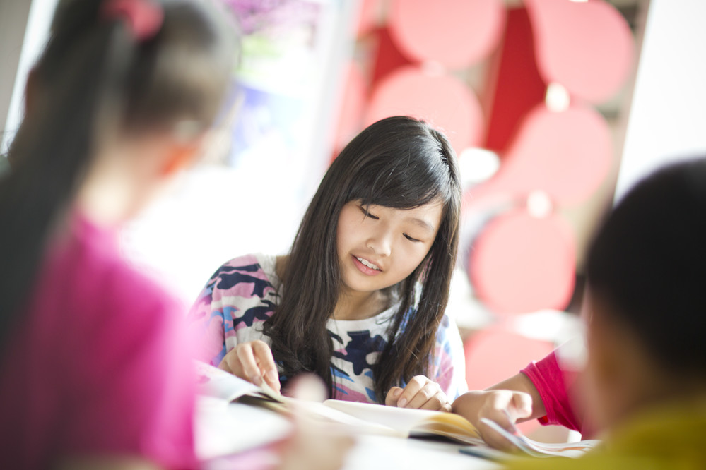 a girl reading in class
